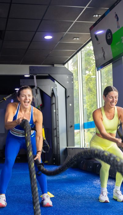 Women working out happy at SWEAT440