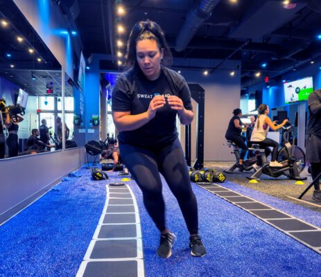 Woman working out at SWEAT440
