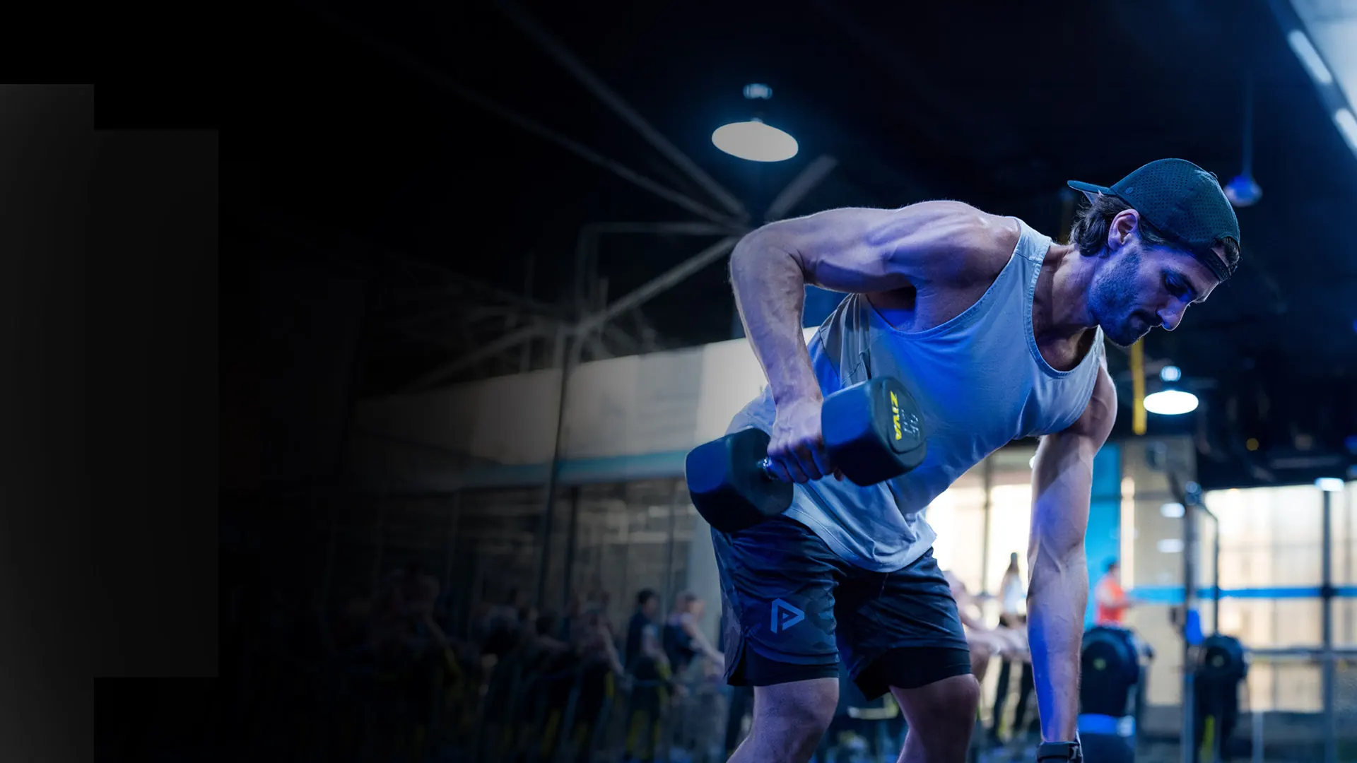 SWEAT440 franchise studio member training with dumbbells