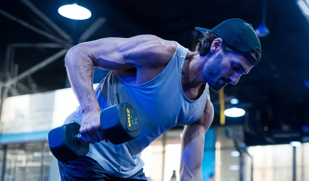 SWEAT440 franchise studio member training with dumbbells
